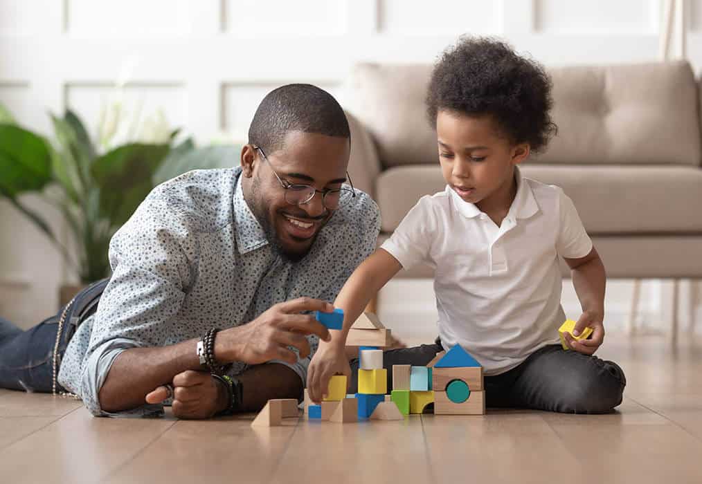 Father & Son building with blocks of wood.